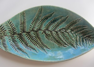 Fern dish in iron oxide with green transparent glaze